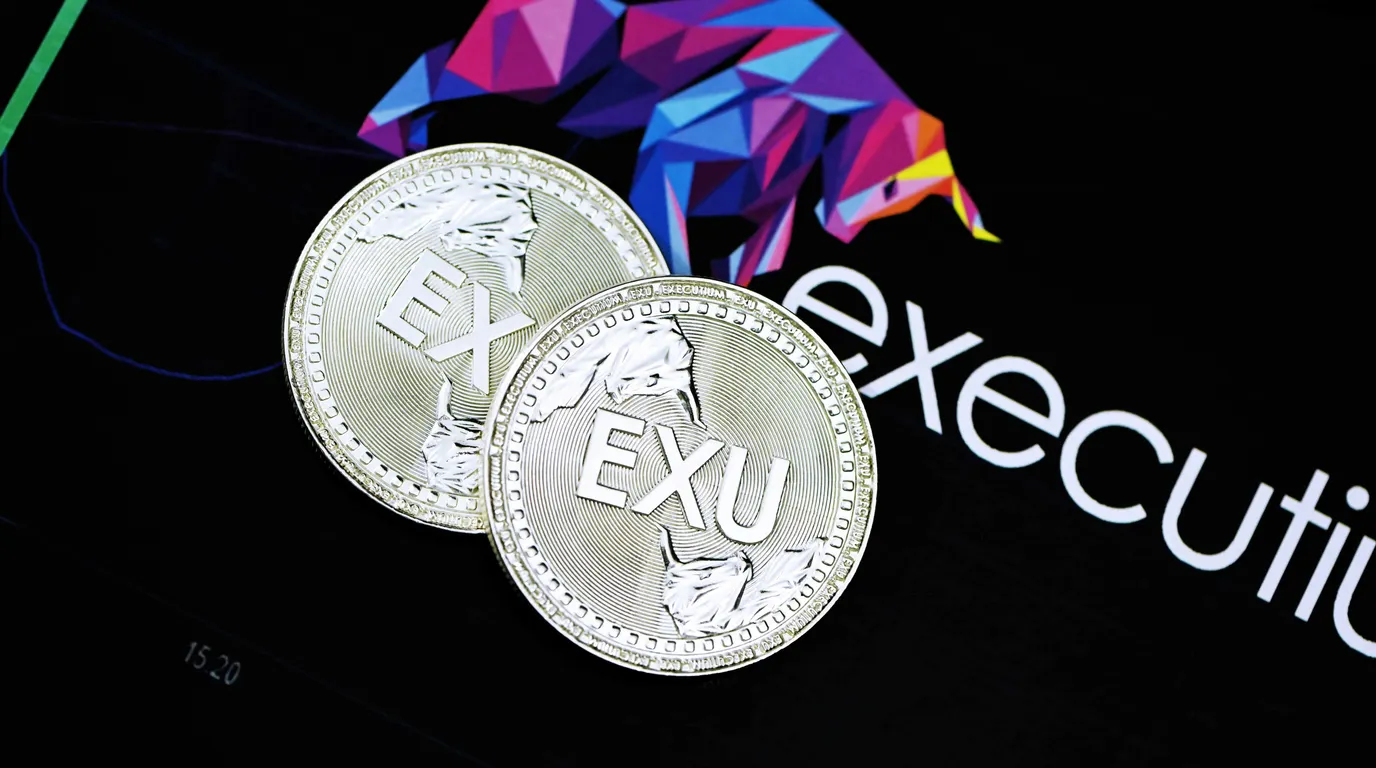Two embossed silver coins resting on a dark screen that displays a low-polygon bull graphic and faint chart lines.